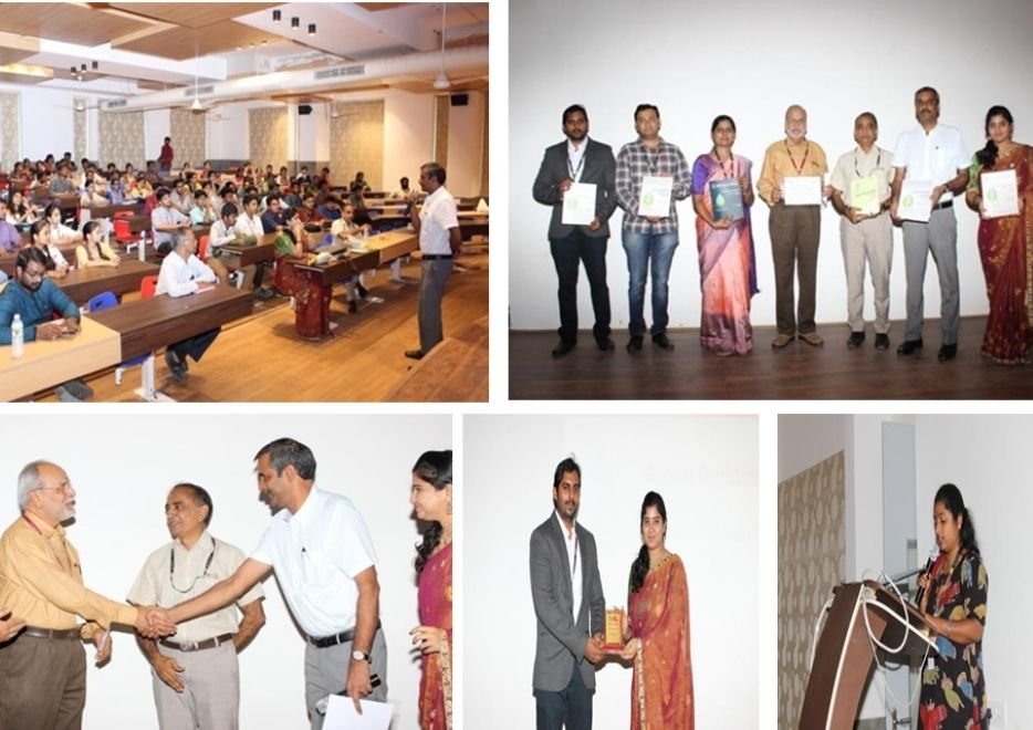 Two men in bicycle jerseys sitting outside at table having coffee